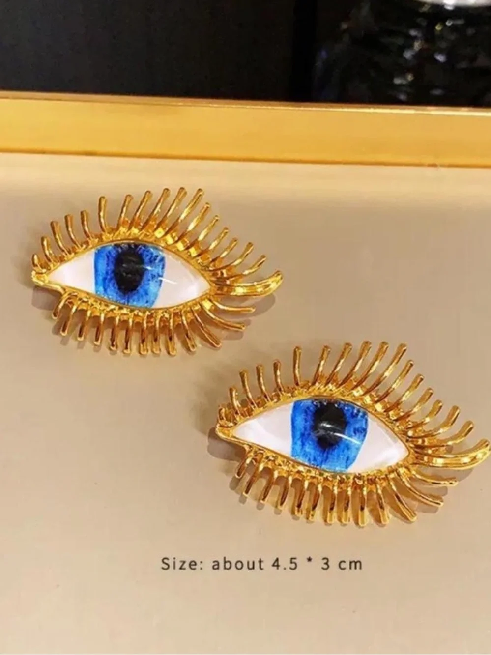 Schiaparelli Gold Eye Statement Earrings with Blue Iris